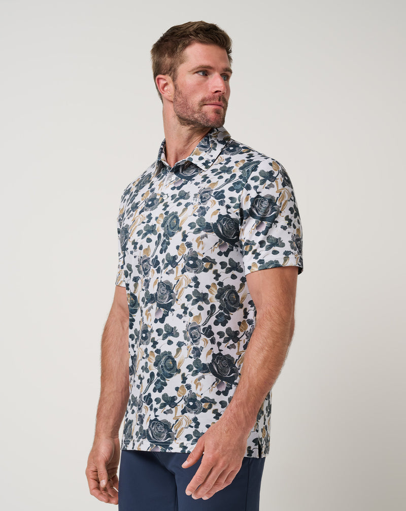 Travis Mathew Featherweight Villa Polo – floral print detail on white
